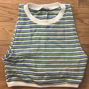 A knitted blue, yellow, green, and white tank top